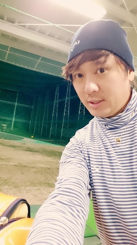 Muneharu Takemoto at an indoor driving range.